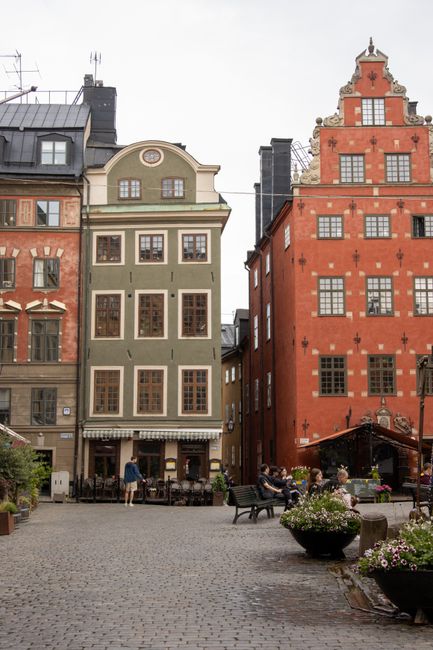 Historic buildings in Stockholm's Gamla Stan with vibrant facades and cobblestone streets.
