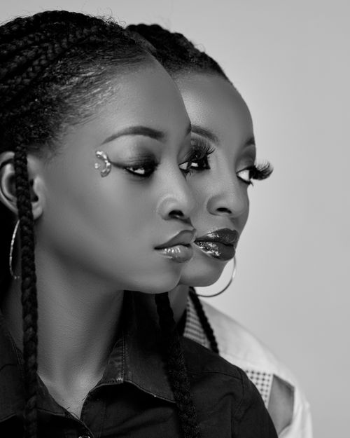 Free Black and white portrait of two women with braided hair in side profile. Stock Photo
