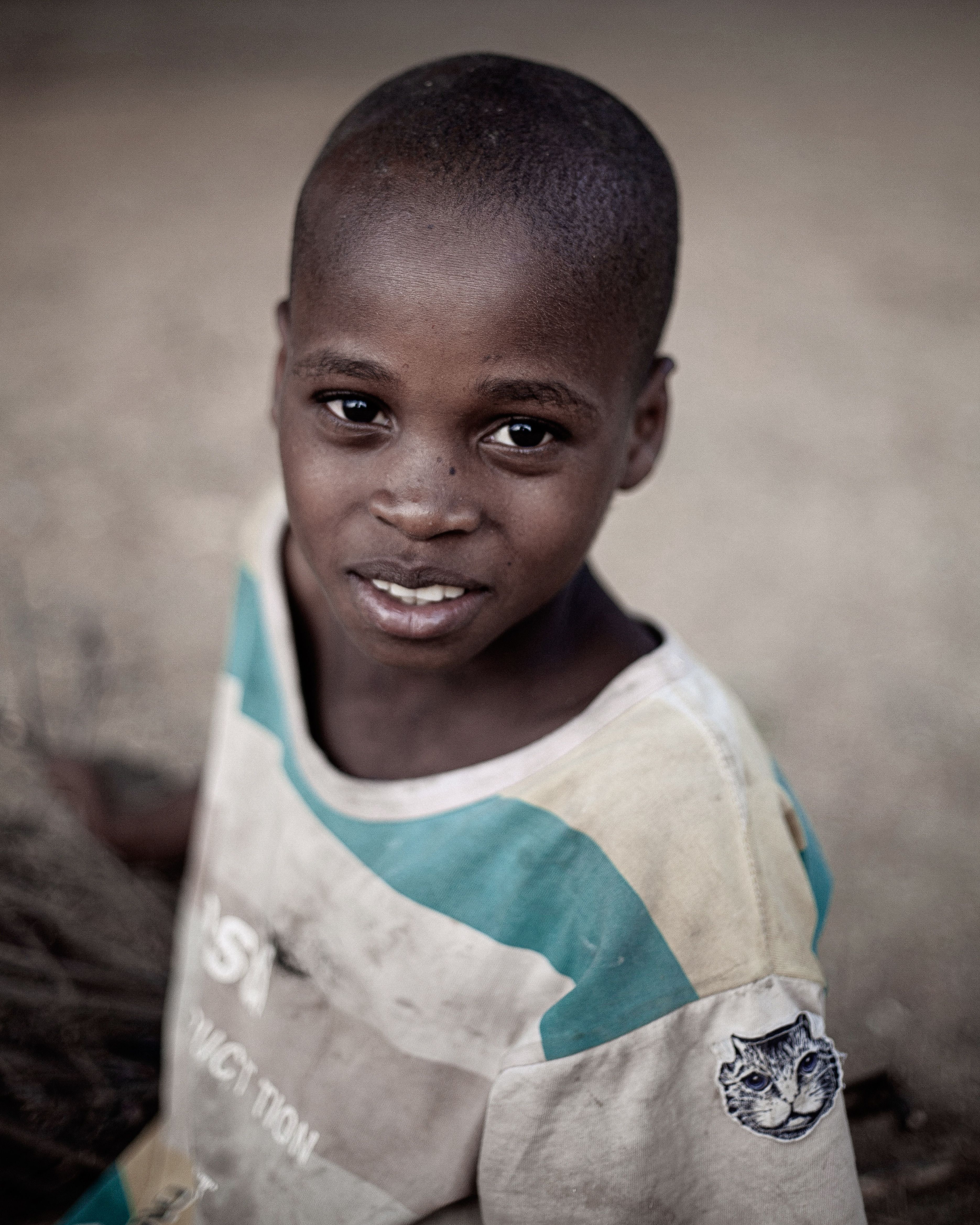 Portrait of a Smiling Young Boy Outdoors · Free Stock Photo