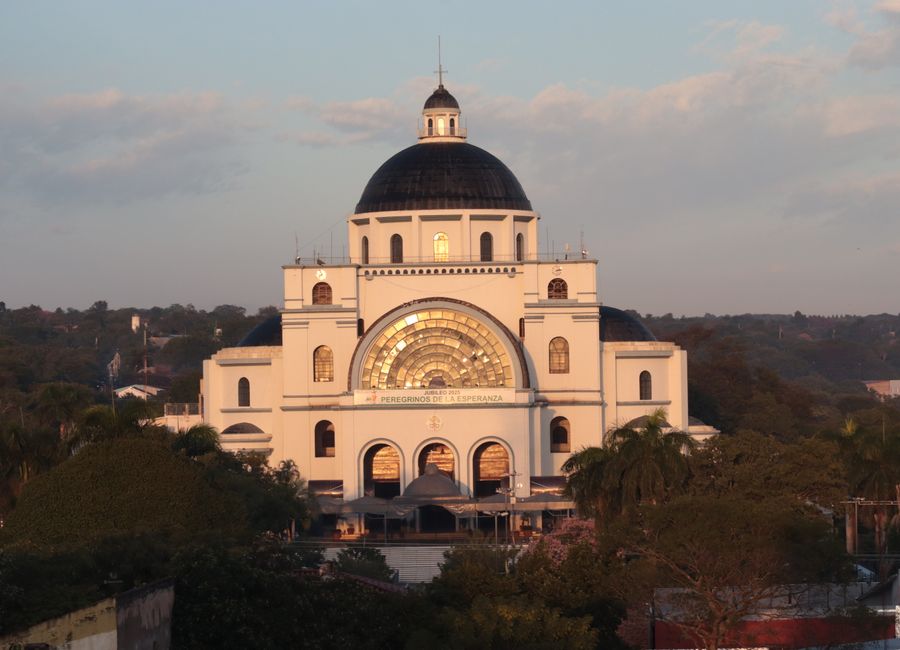 Stunning view of the Basilica of Our Lady in Caacupé during a golden sunset.