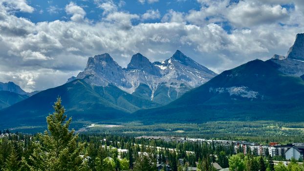 Majestic view of the Three Sisters Mountains in the breathtaking Canadian Rockies.