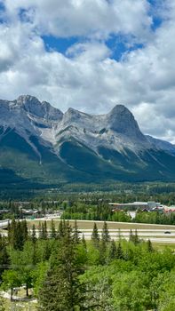 Breathtaking landscape of the Three Sisters mountain range in Banff, Alberta, Canada.