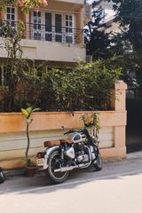 A classic motorcycle on a quiet Bengaluru street