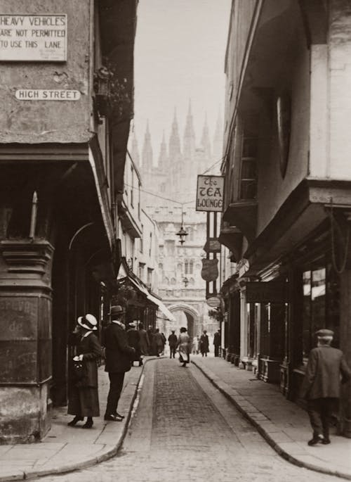 Old Photo Of A Narrow Street With People