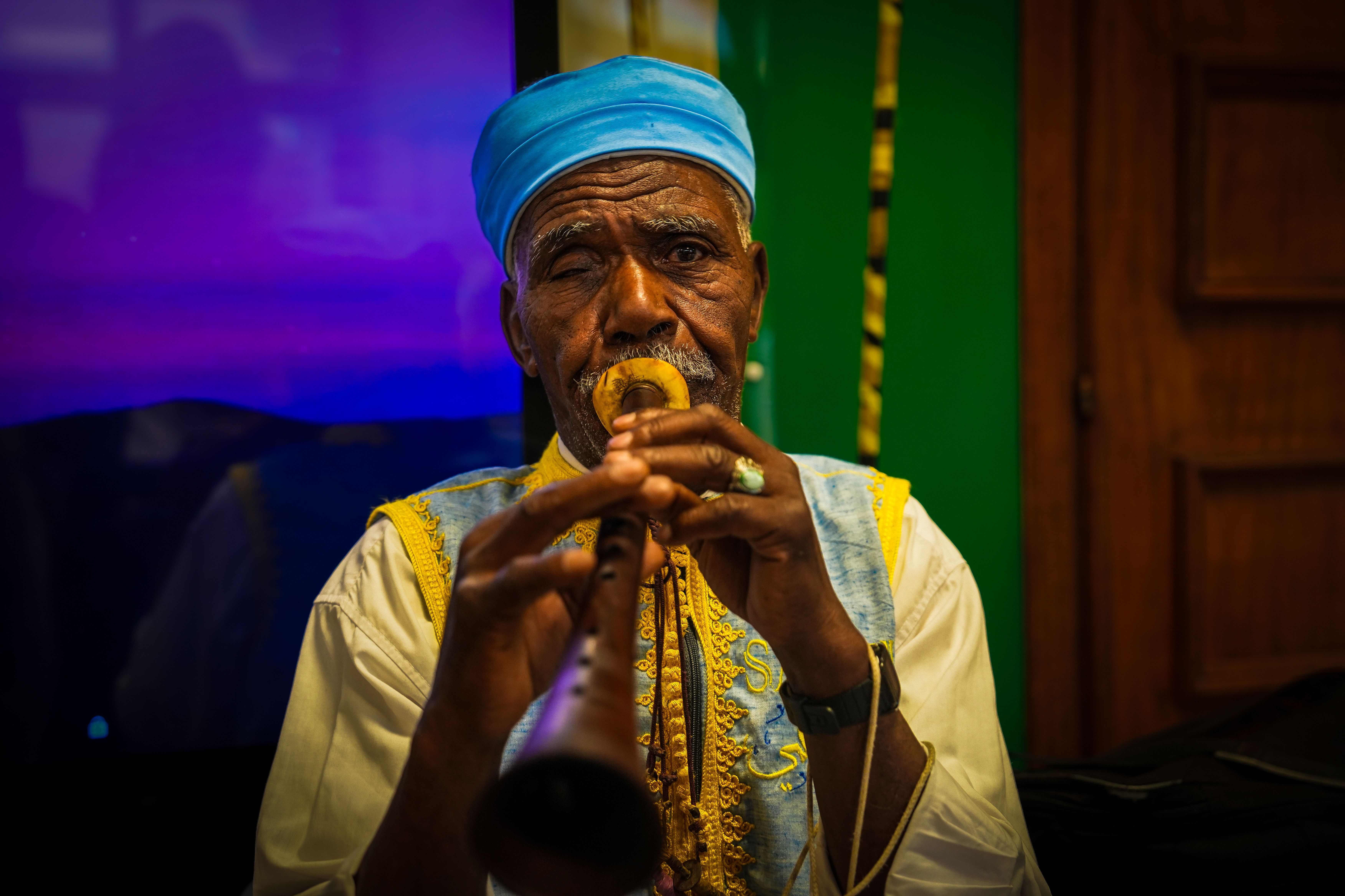 Vibrant Portrait of a Musician in Traditional Attire · Free Stock Photo