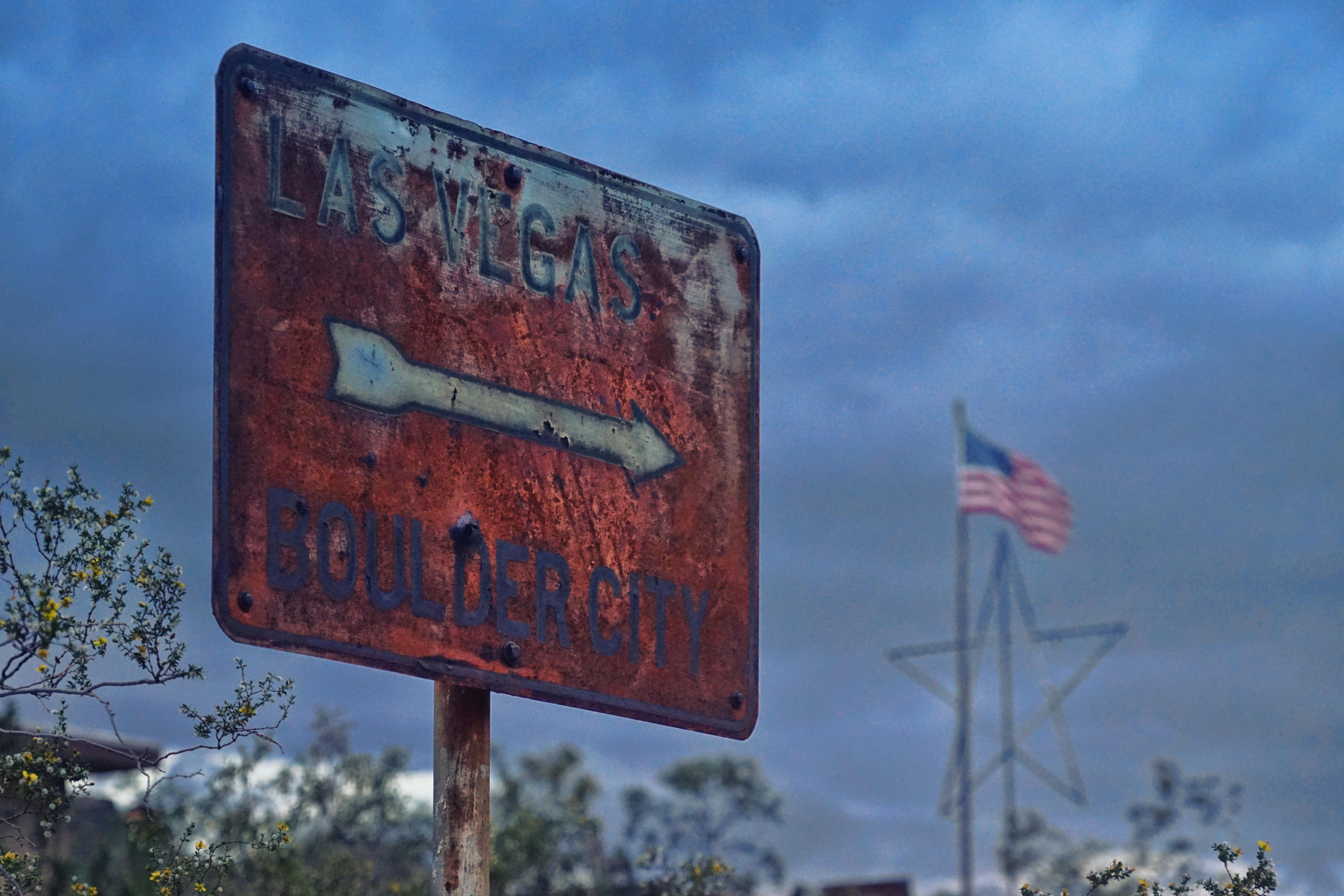 a old rusty red and white signage