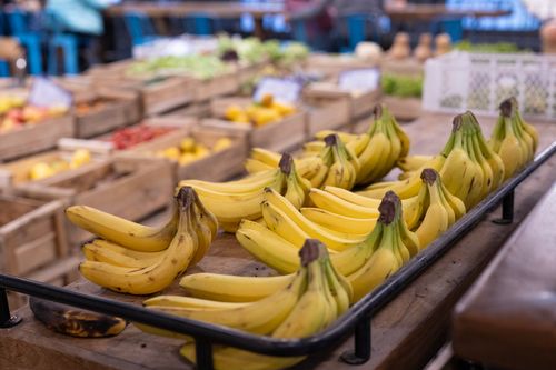 Free Vibrant display of bananas at a bustling market in Santiago, Chile. Stock Photo