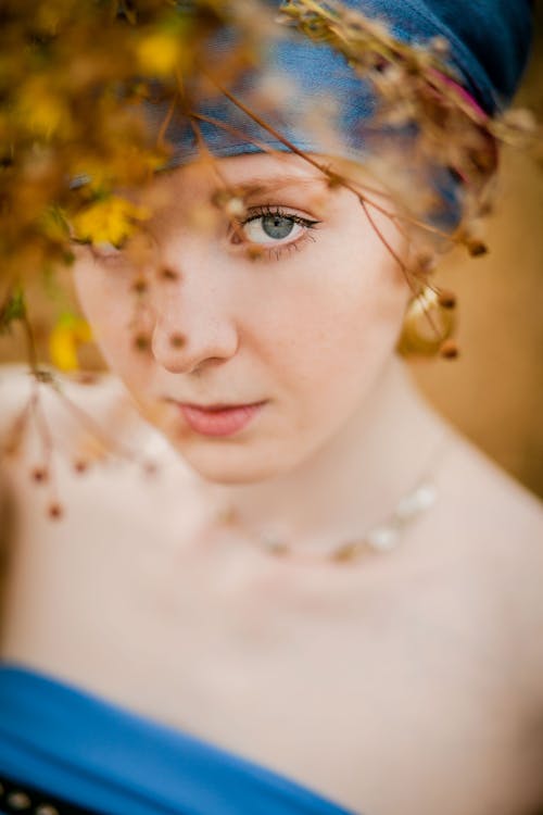 Free Selective Focus Photography of Woman Wearing Blue Top and Blue Headwear Stock Photo