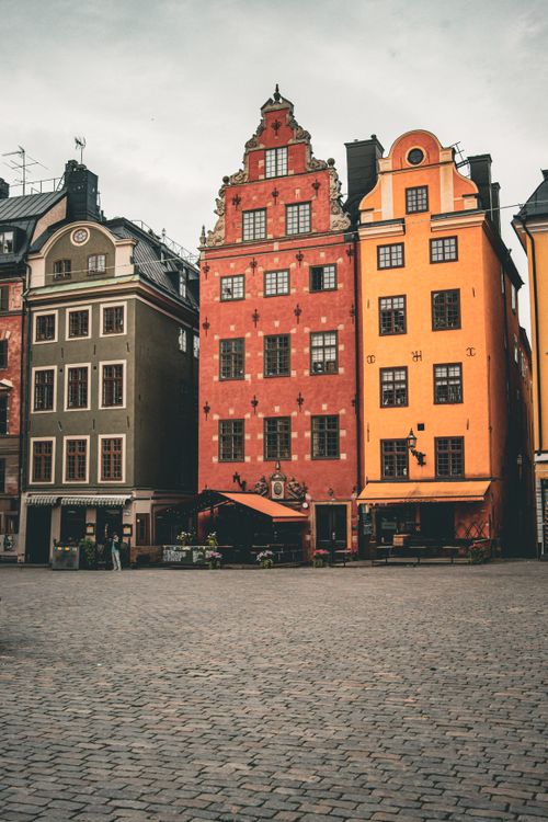 Free Scenic view of colorful historic buildings in Gamla Stan, Stockholm's vibrant old town. Stock Photo