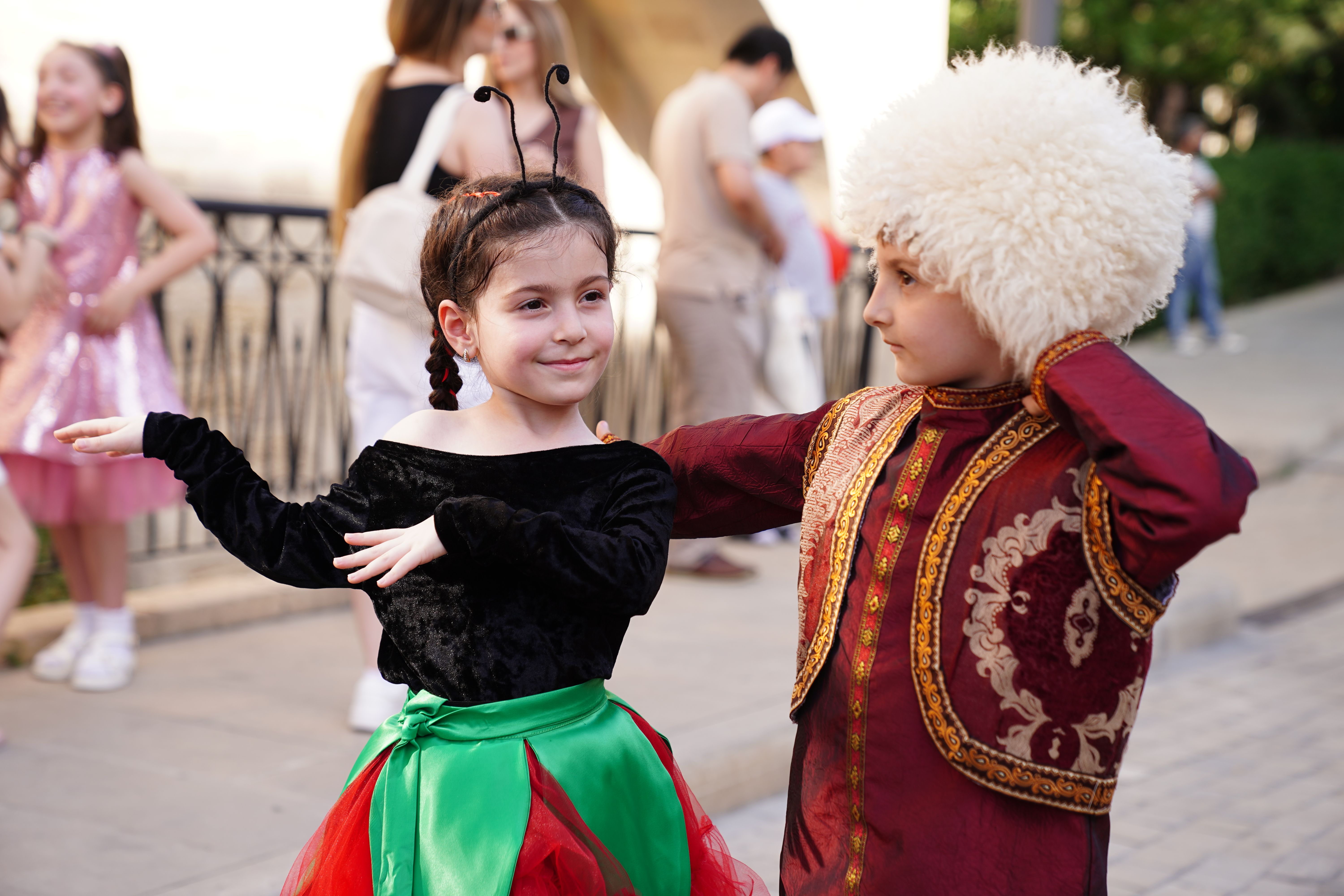 Children in Traditional Costumes at Outdoor Festival · Free Stock Photo