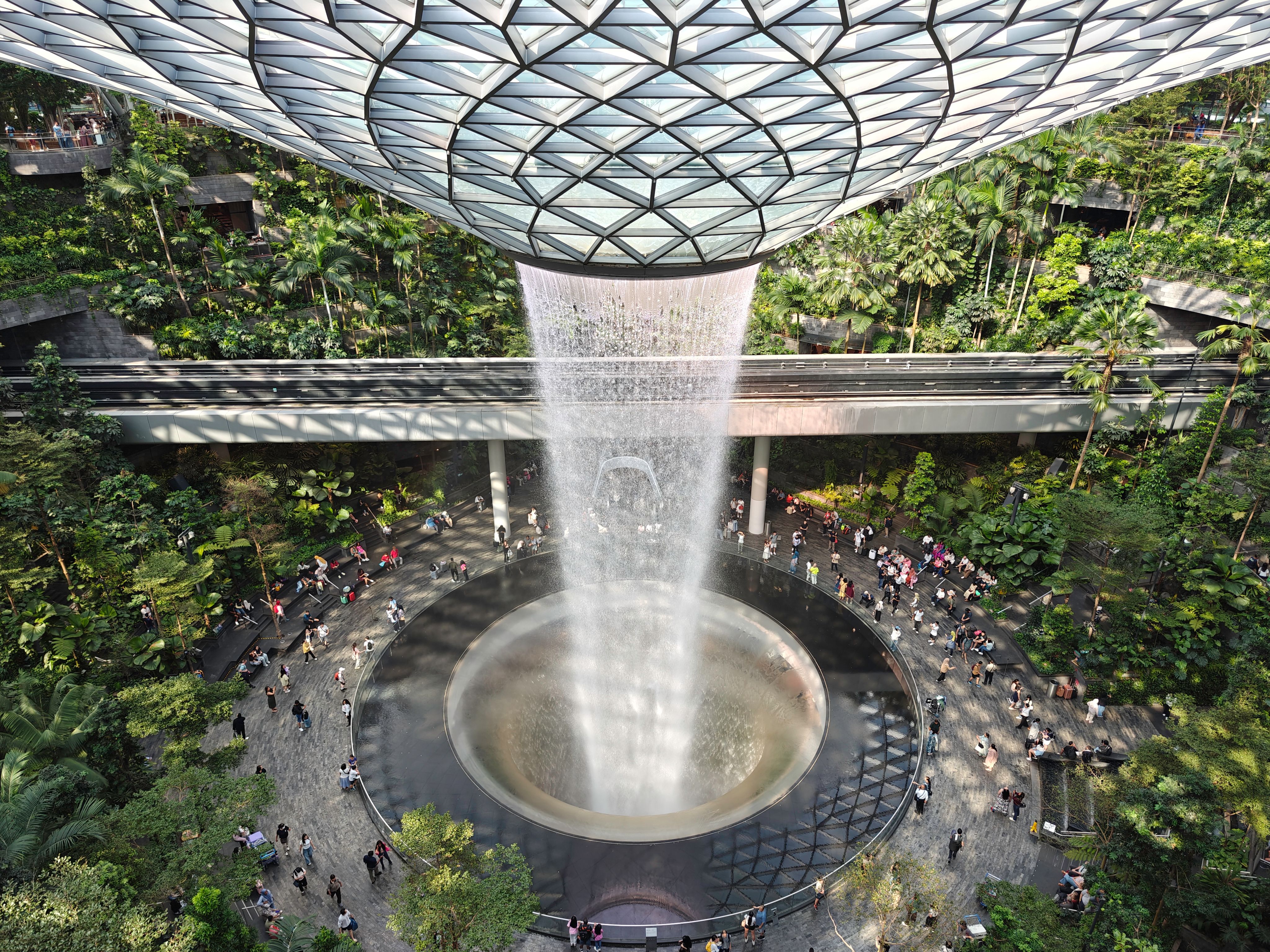 Travelers at Singapore Changi Airport Jewel, a hub for airport connections