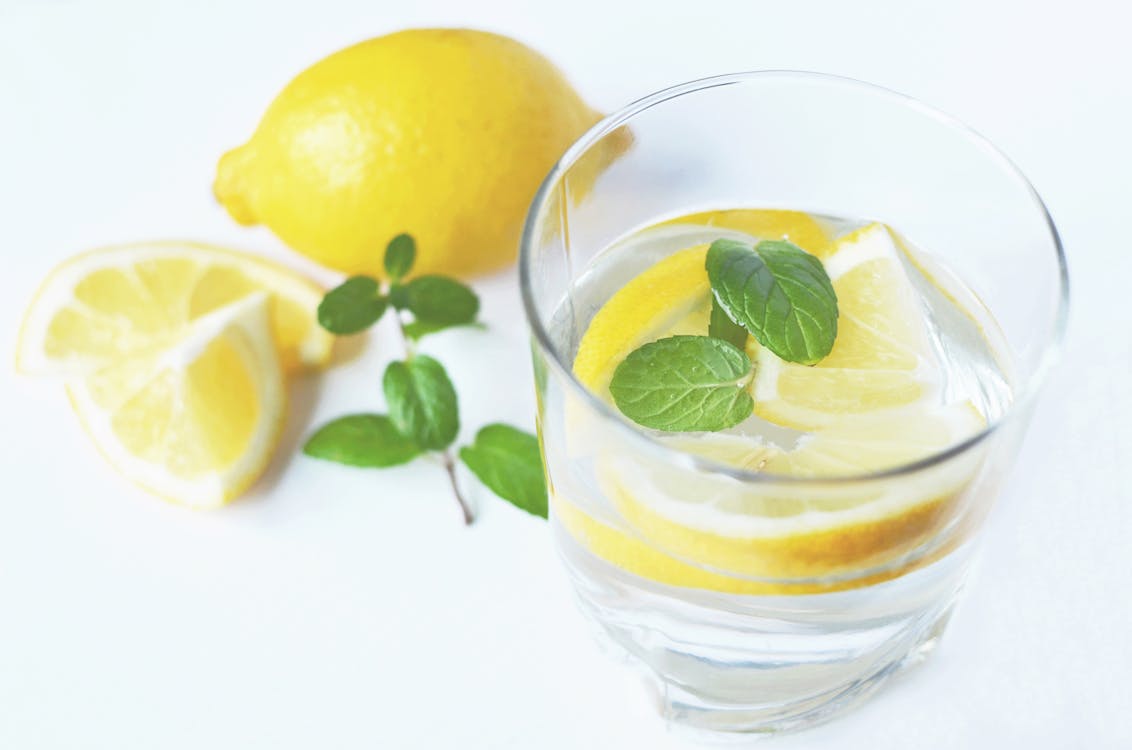 Clear Drinking Glass With Slice Lemon