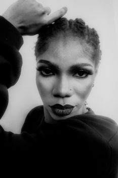 Expressive black and white portrait highlighting confidence and style.