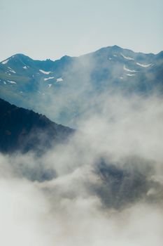 Majestic misty mountain landscape captured during early morning, showcasing nature's serene beauty.