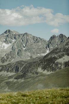 Breathtaking view of rugged mountain peaks under a clear blue sky, perfect for nature enthusiasts.