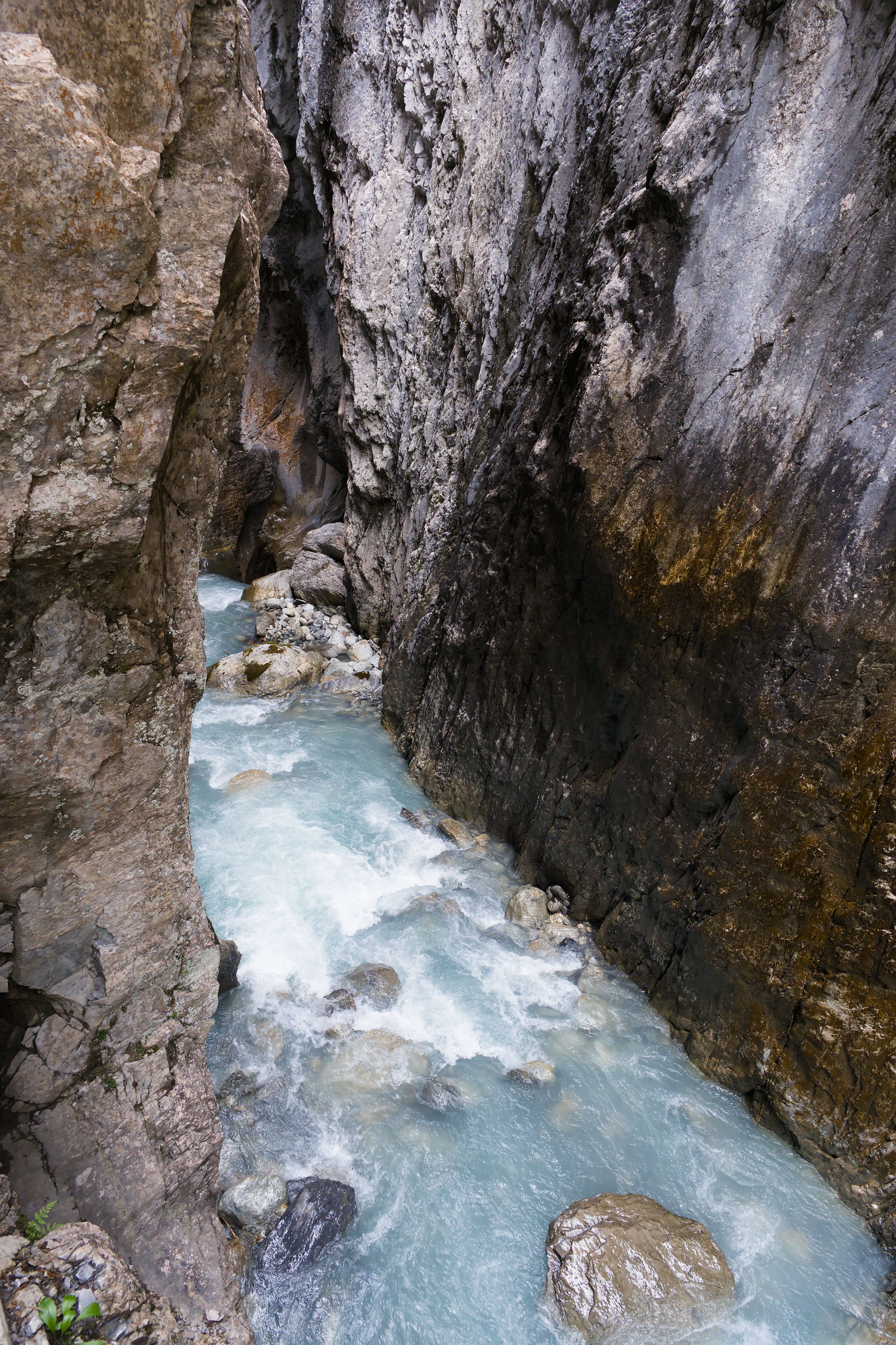 swollen mountain river in a narrow valley