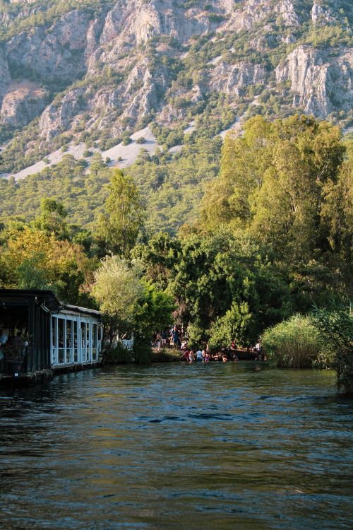Free Enjoy a tranquil boat cruise in Akyaka, Muğla, surrounded by lush nature. Stock Photo