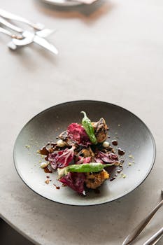 Delicious high-end Japanese fusion dish elegantly plated in a modern Tokyo restaurant setting.