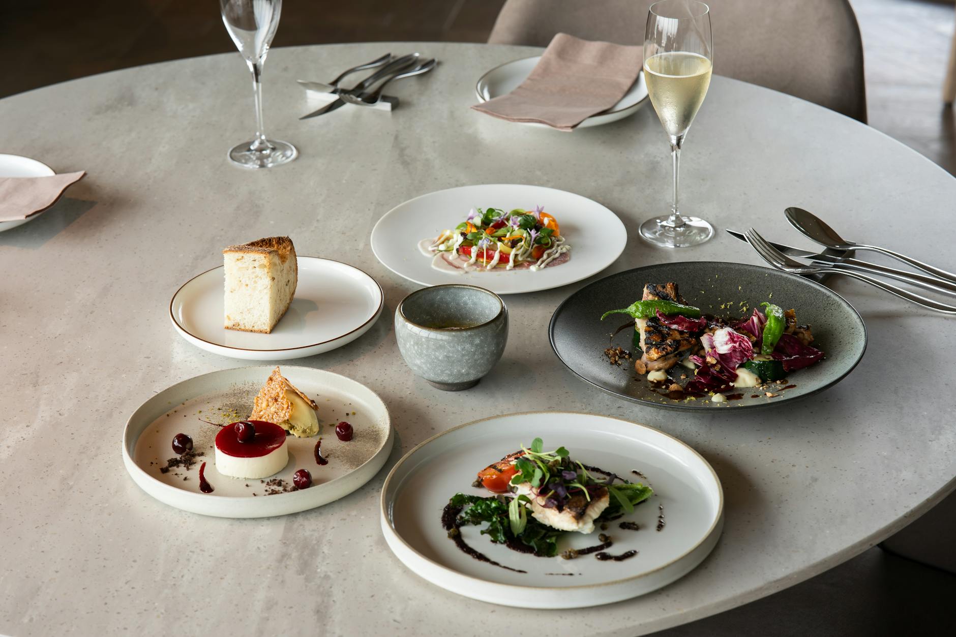 Elegant fine dining setup with gourmet dishes and wine in Tokyo, Japan. Elegant fine dining setup with gourmet dishes and wine in Tokyo, Japan.