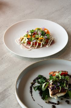 Artfully plated dishes highlighting fine dining in a Tokyo cafe, showcasing fresh ingredients and artistic presentation.