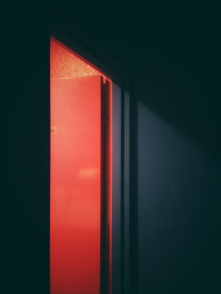 An Open Red Flush Door