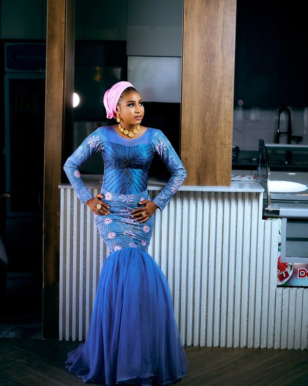 Elegant Woman Posing in Blue Dress Indoors · Free Stock Photo