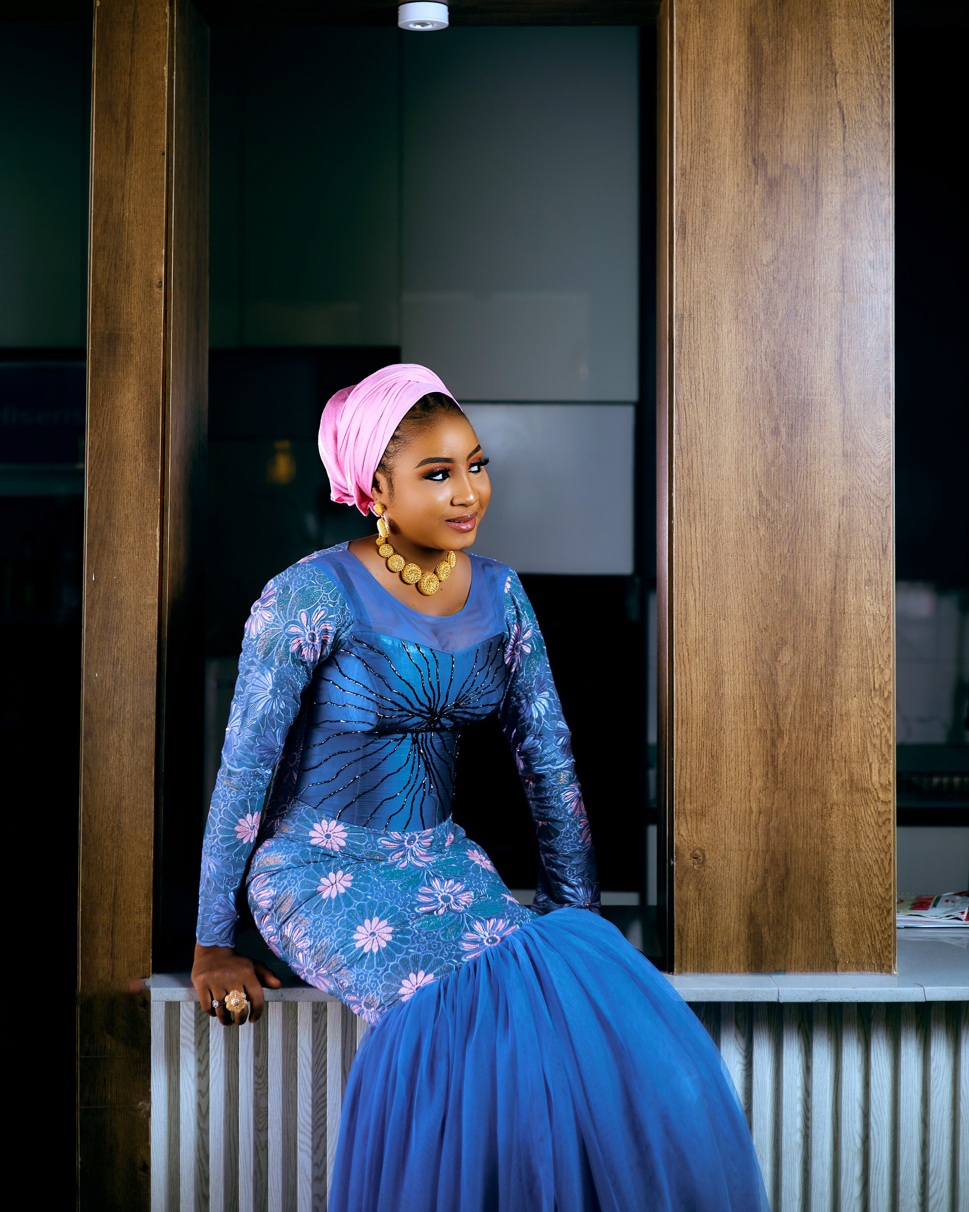 Elegant Woman in Blue Traditional Dress Indoors · Free Stock Photo