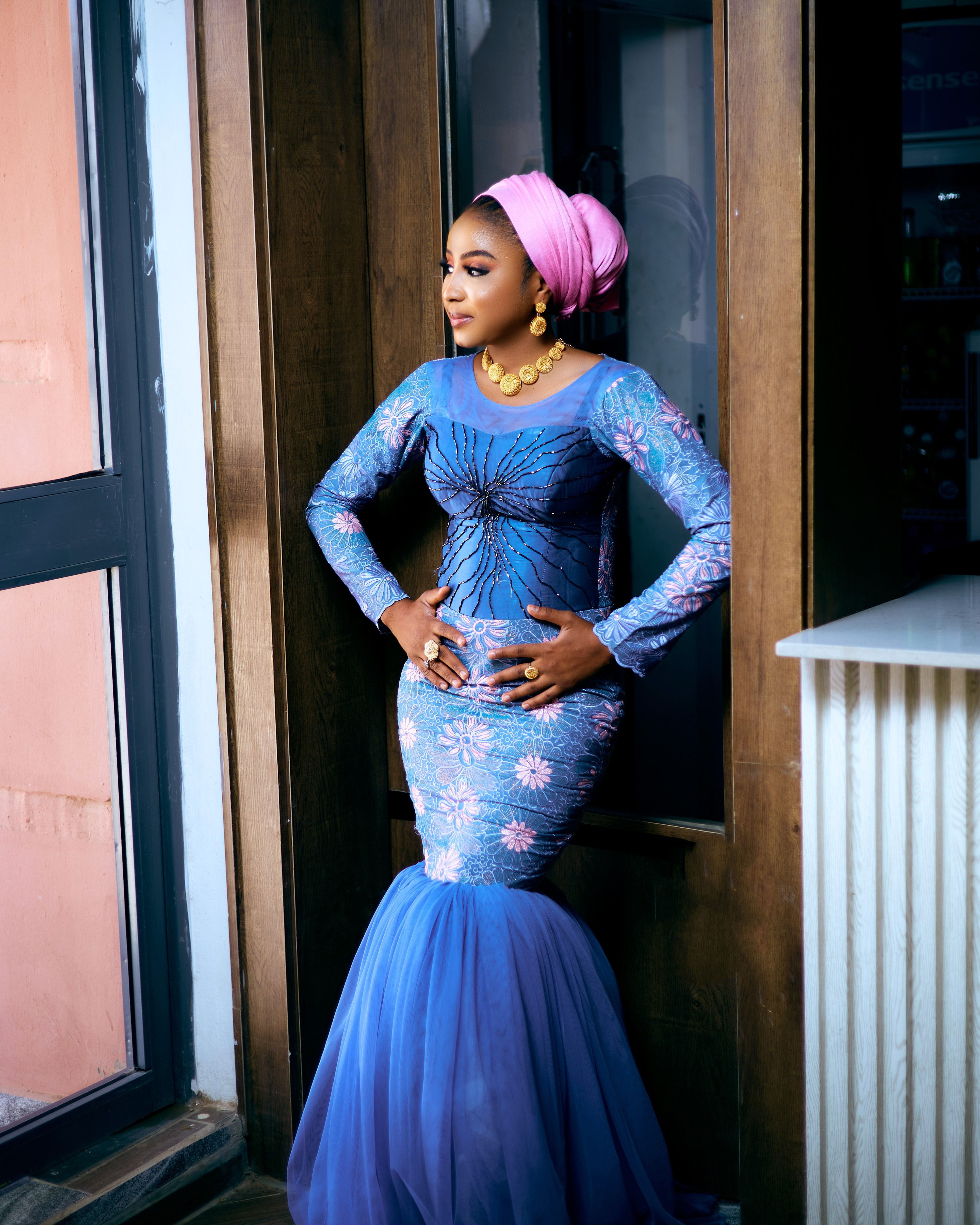 Elegant Woman in Traditional Blue African Attire  Free Stock Photo