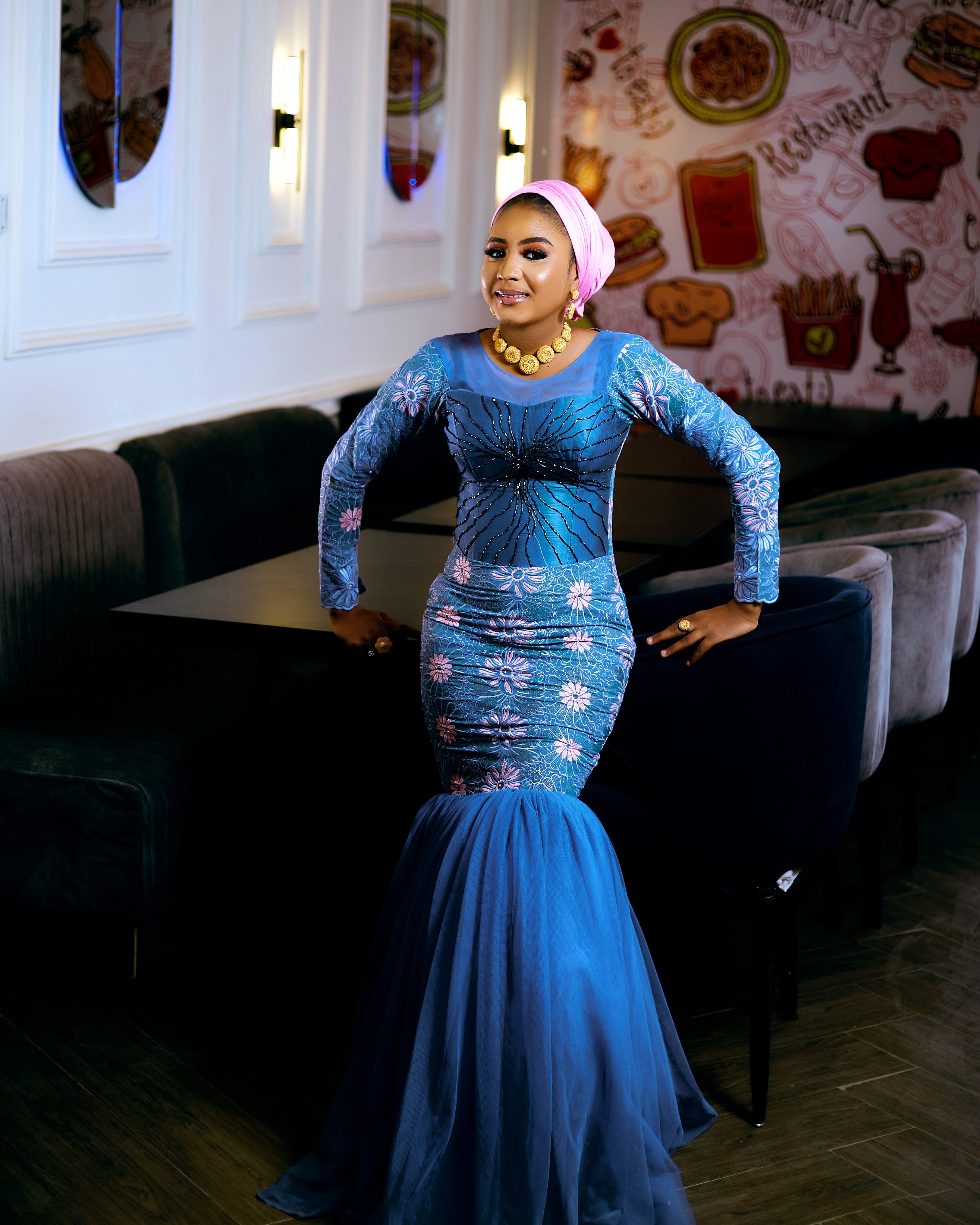 Elegant Woman in Traditional Blue Dress Indoors · Free Stock Photo
