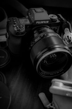 Close-up of a Fujifilm camera with lens, perfect for photography-related projects.