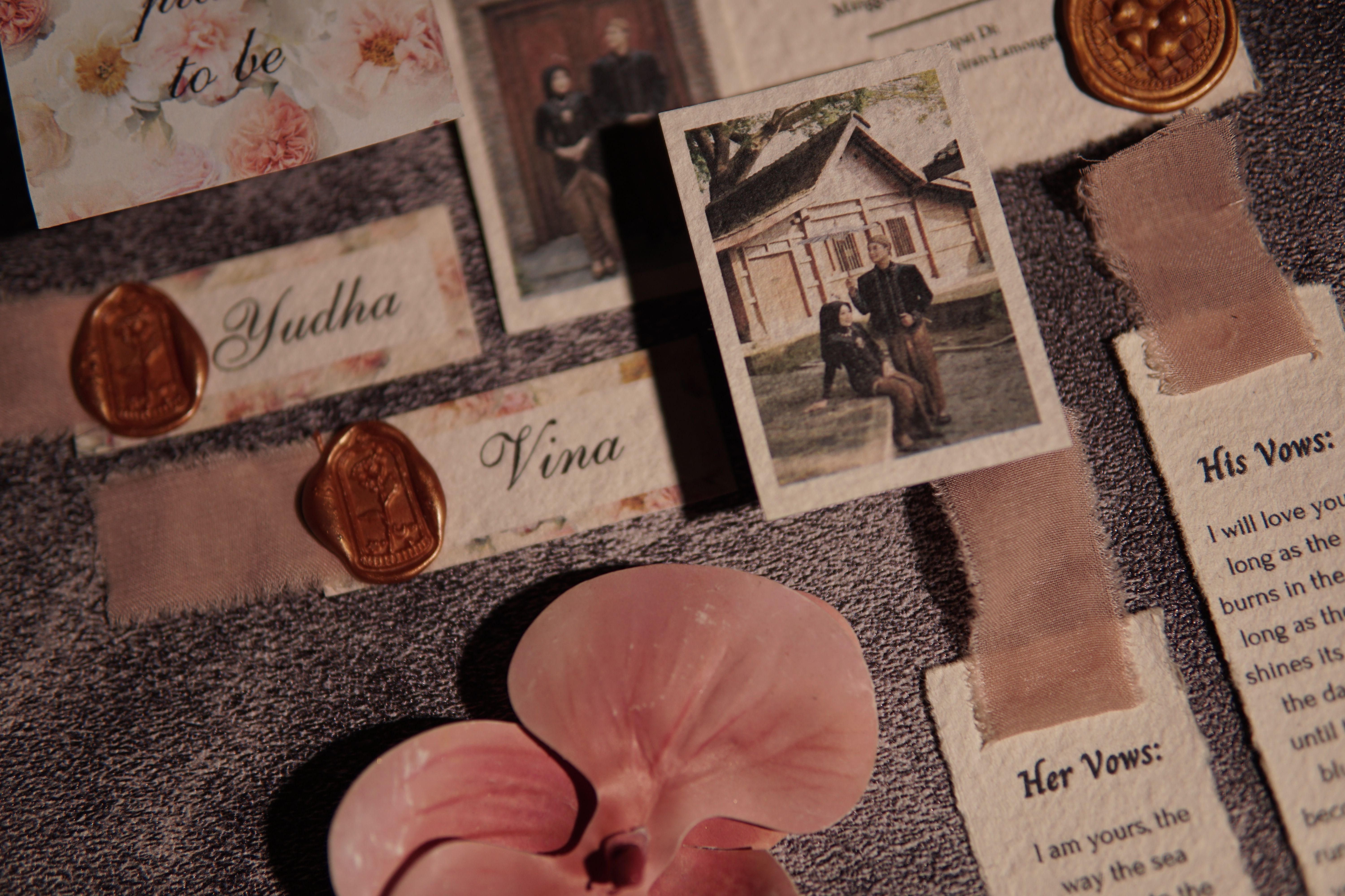 Wedding invitations with wax seals and floral decor, capturing elegance in East Java, Indonesia.