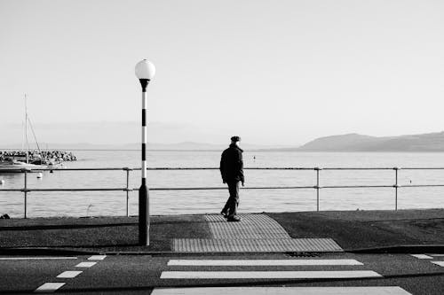 Person Standing on Sidewalk