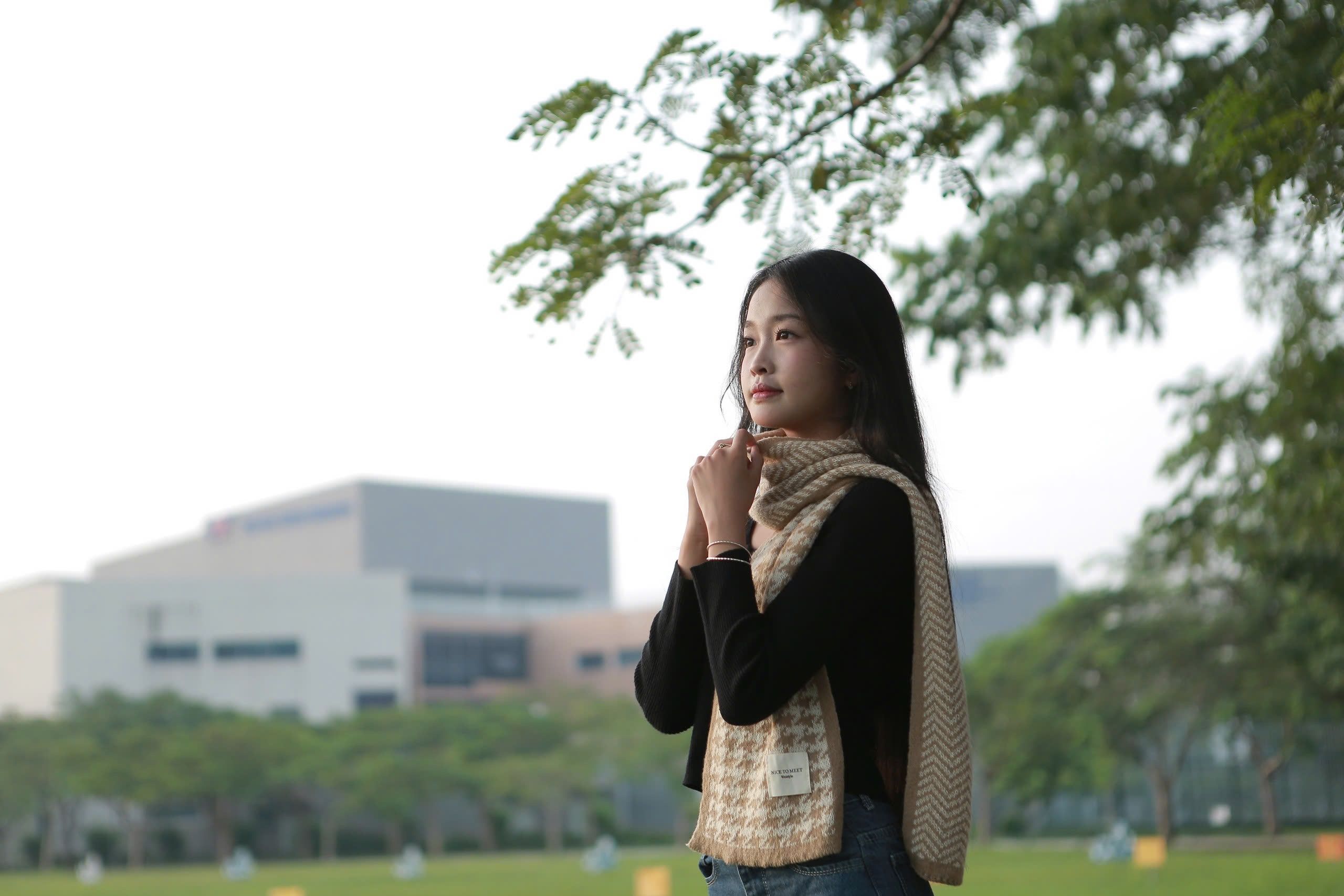 Young Woman Enjoying Nature in Urban Park Setting · Free Stock Photo