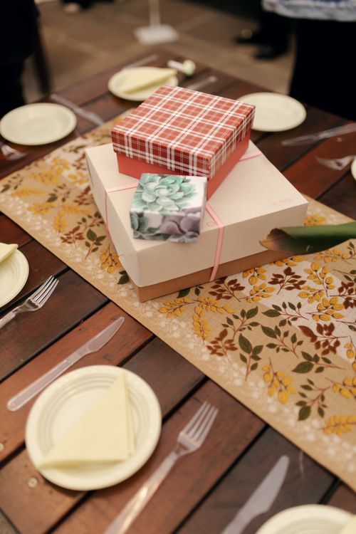 Free Artfully arranged gift boxes on a decorated dining table, perfect for celebrations. Stock Photo