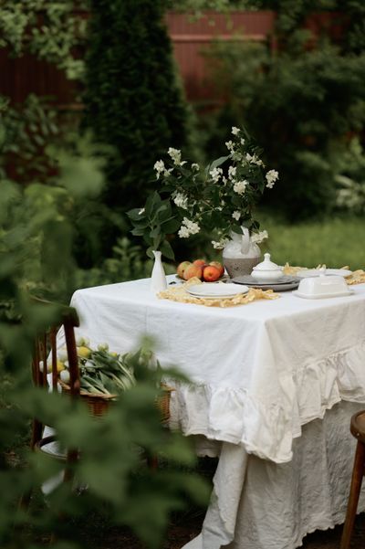 Washed linen tablecloth on an outdoor table — photo by Liana Tril' on Pexels