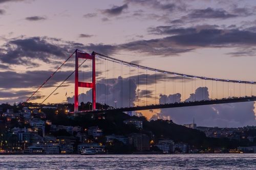 Free Scenic view of the Bosphorus Bridge at dusk with vibrant city lights in Istanbul, Turkey. Stock Photo