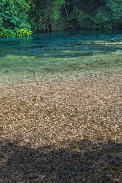 Free Discover the serene beauty and crystal clear waters of the Blue Eye Spring in Vlorë County, Albania. Stock Photo
