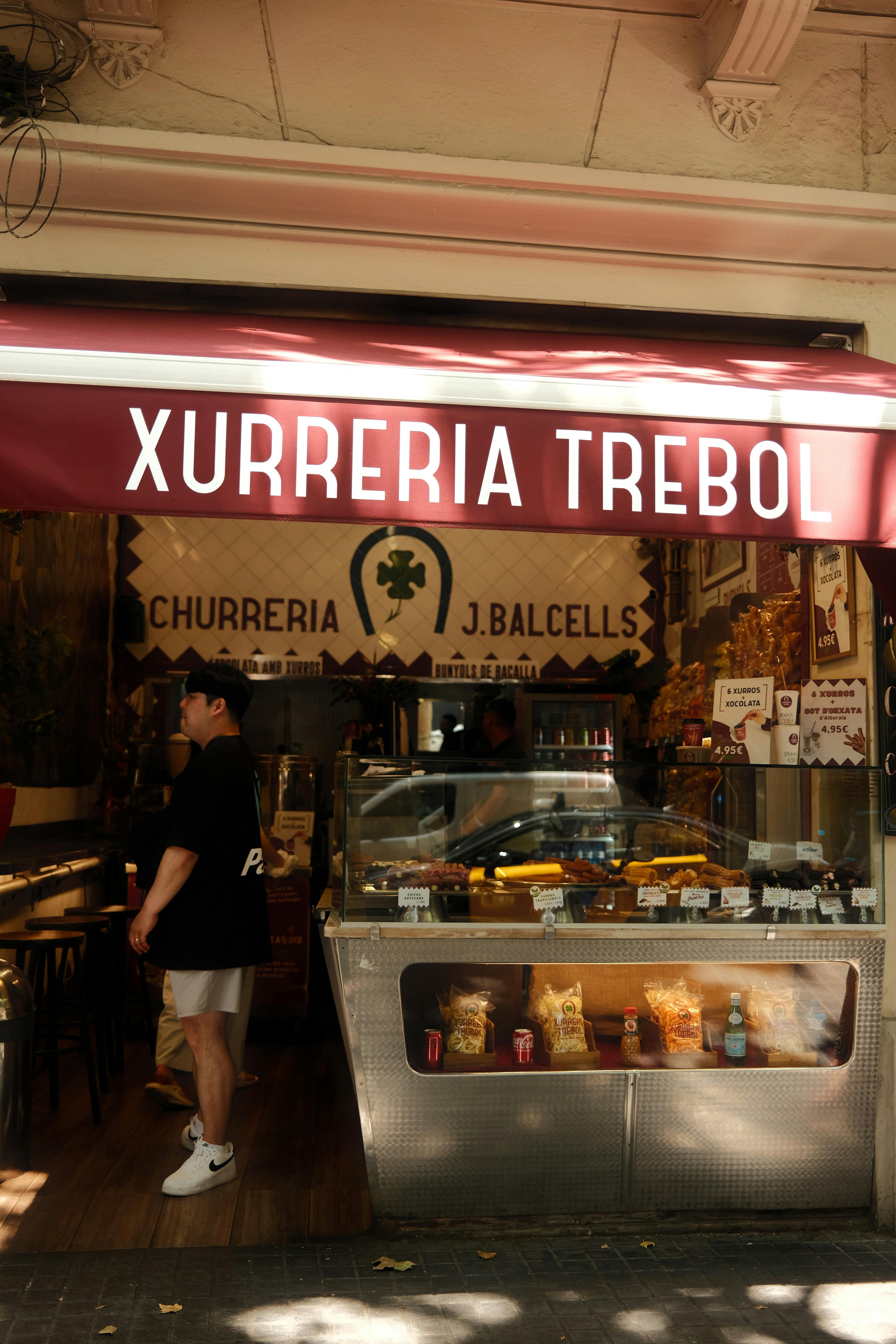 Xurreria Trebol churro shop front in Barcelona, capturing local street food culture.