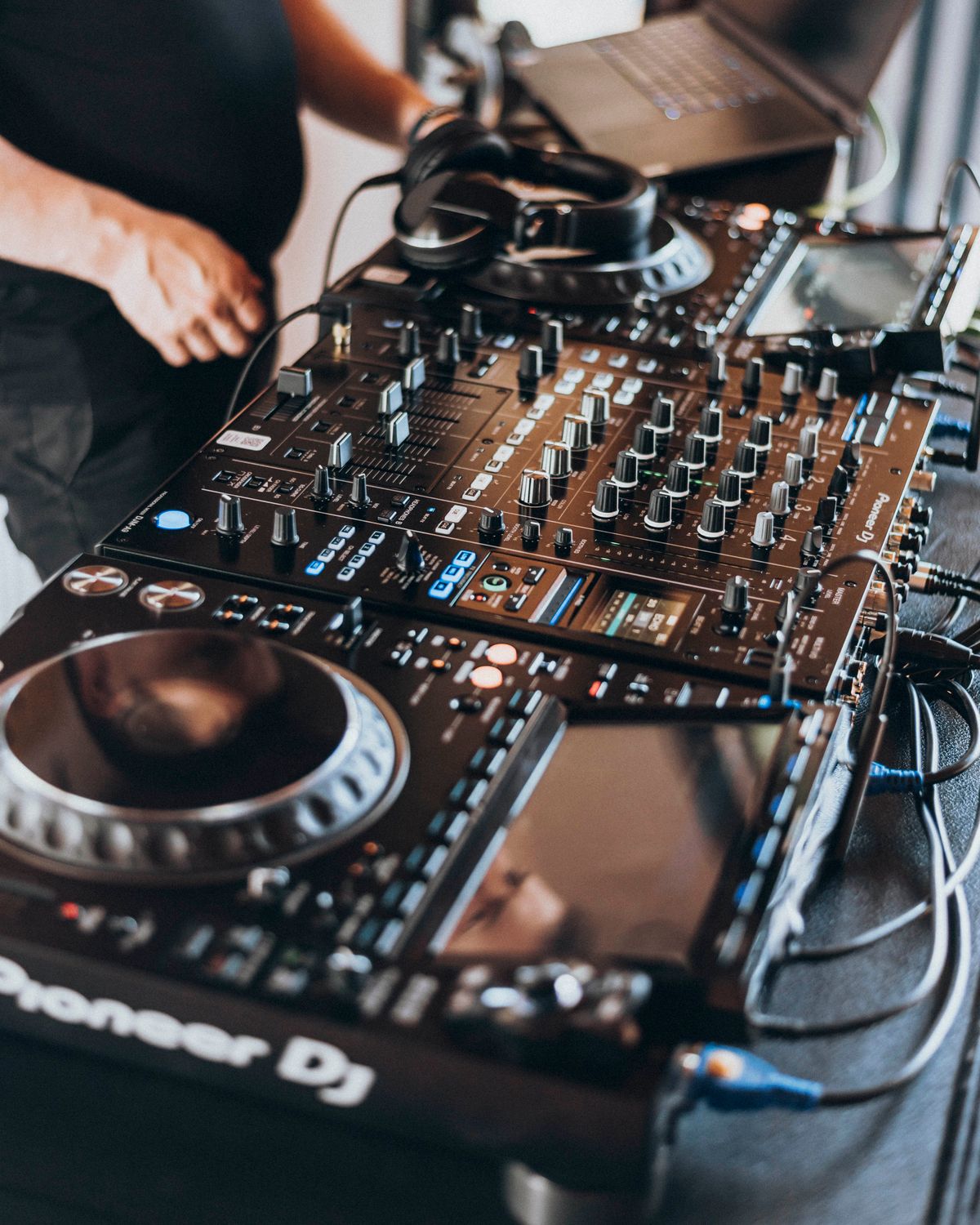 Dj Operating DJ Operating Professional Mixing Equipment at Event · Free Stock Photo