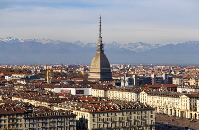 Discover the stunning cityscape of Turin with the iconic Mole Antonelliana and the Alps in the background. — arriving in Caselle Torinese