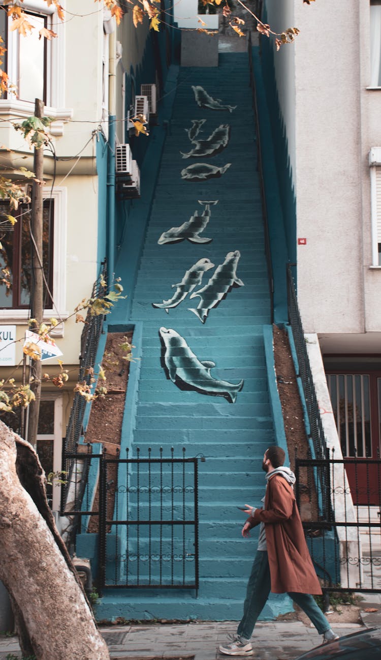 Man Walking Near Stairs