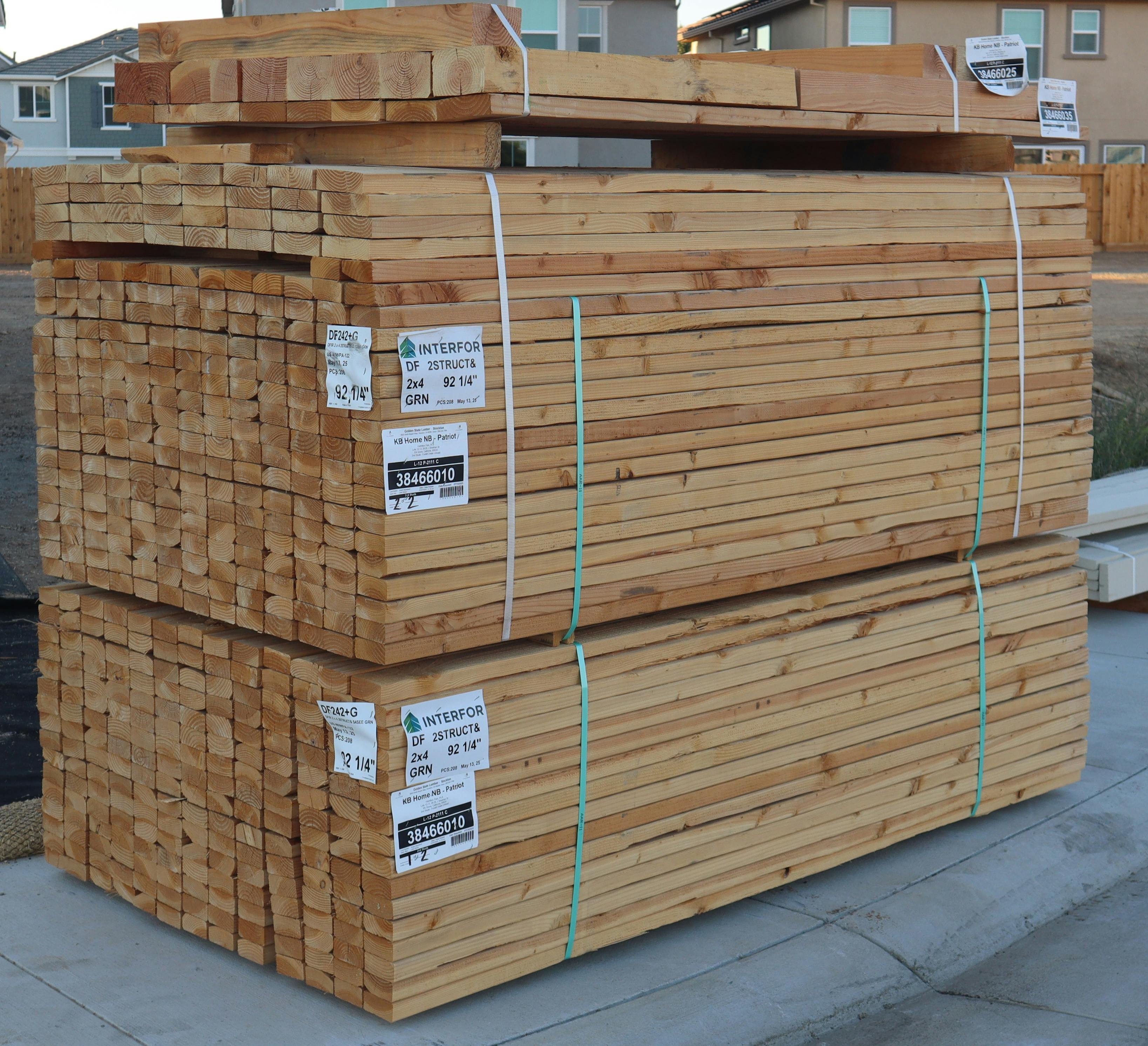 Stack of 20ft Trex Select boards at a Utah supply yard during sunrise - 20ft trex decking