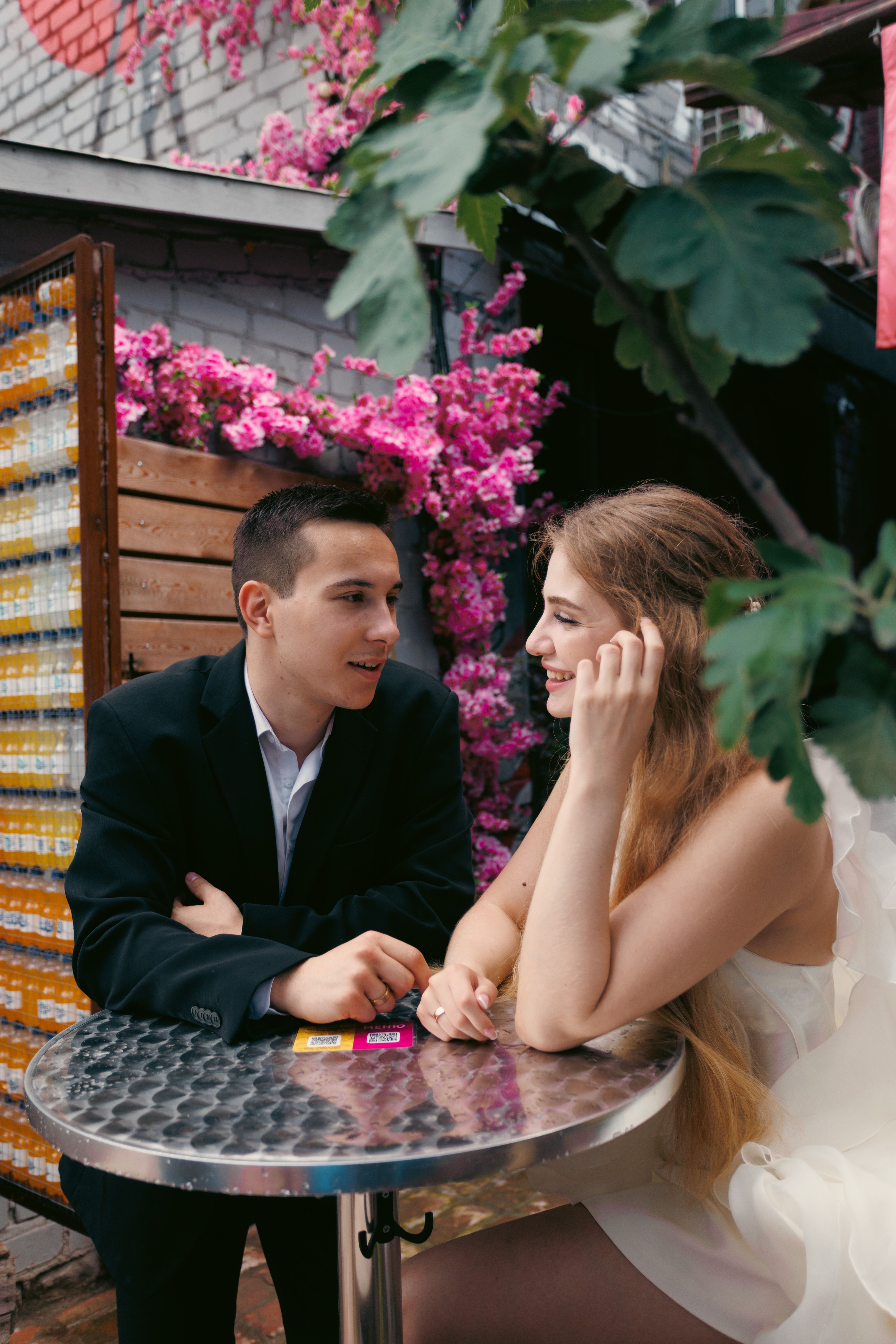 Romantic Outdoor Café Date with Flowers · Free Stock Photo