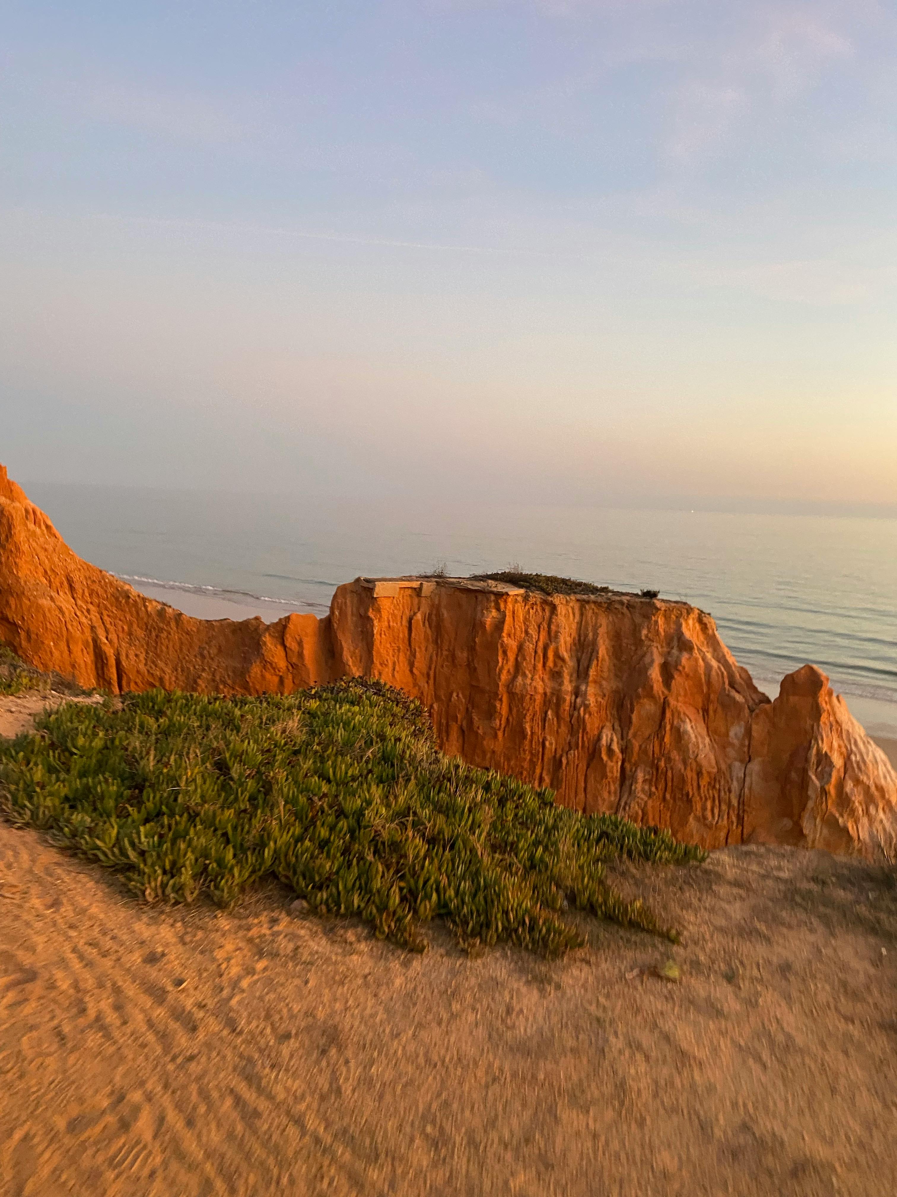 Photographer using a quick-release camera strap in a busy street