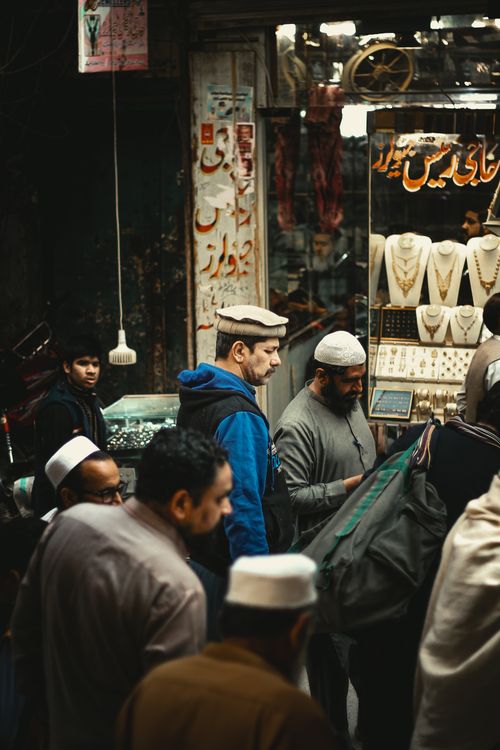 Free Explore the vibrant street market scene in Peshawar with locals in traditional clothing. Stock Photo