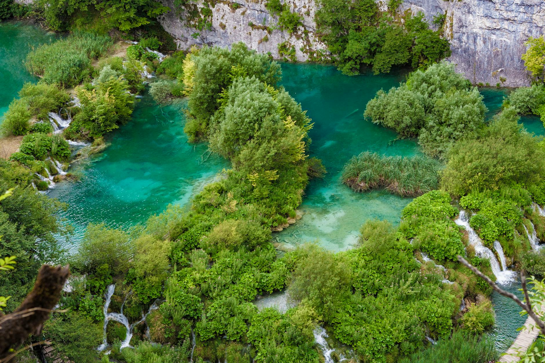 Aerial view of the beautiful emerald waters and lush greenery of Plitvice Lakes National Park, Croatia.