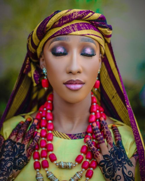 Free Beautiful portrait of a woman with intricate henna and traditional attire. Stock Photo
