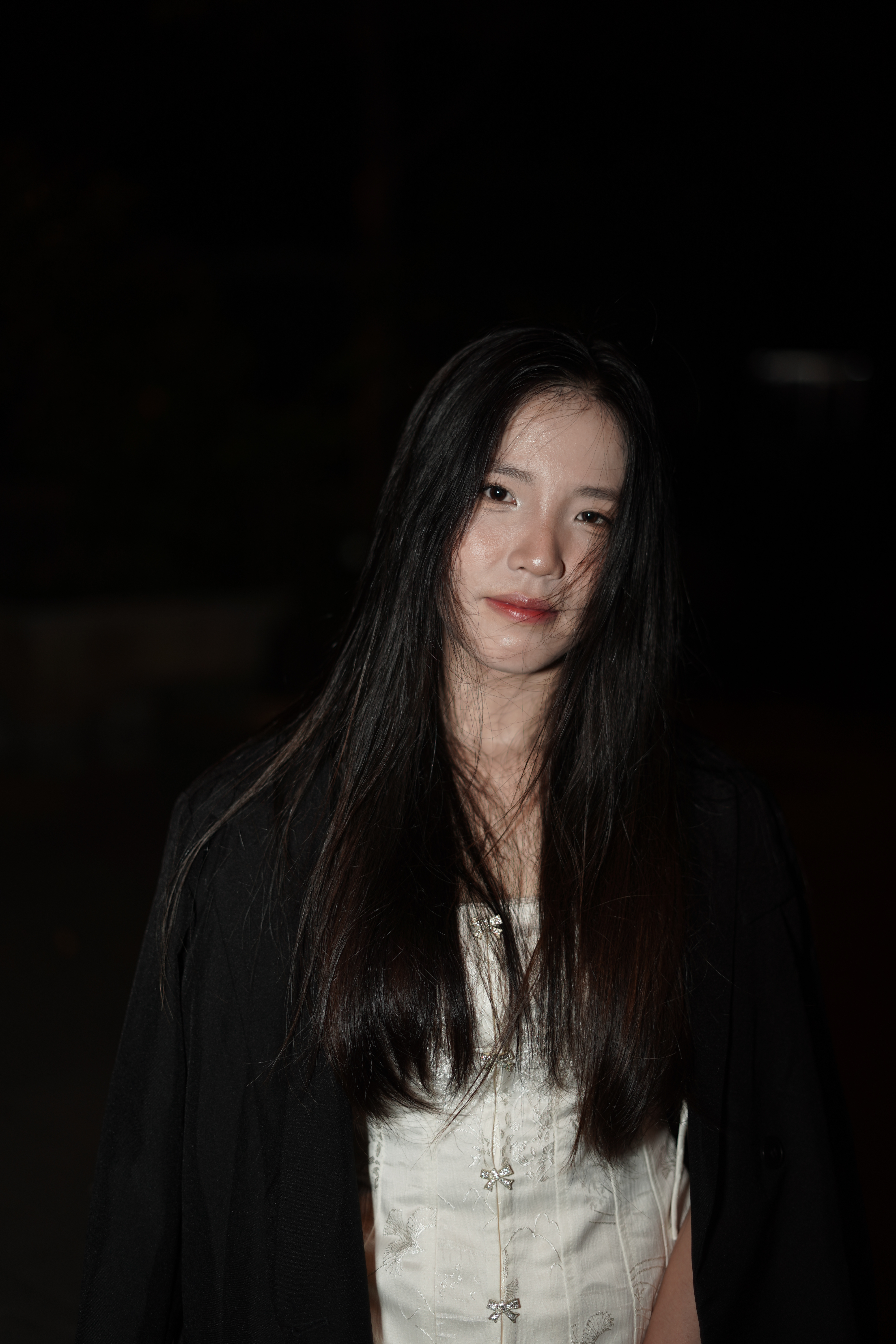 Elegant Young Woman Posing at Night Outdoors · Free Stock Photo
