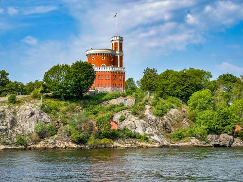 Free Scenic view of Kastellet on Skeppsholmen island in Stockholm, surrounded by lush greenery. Stock Photo