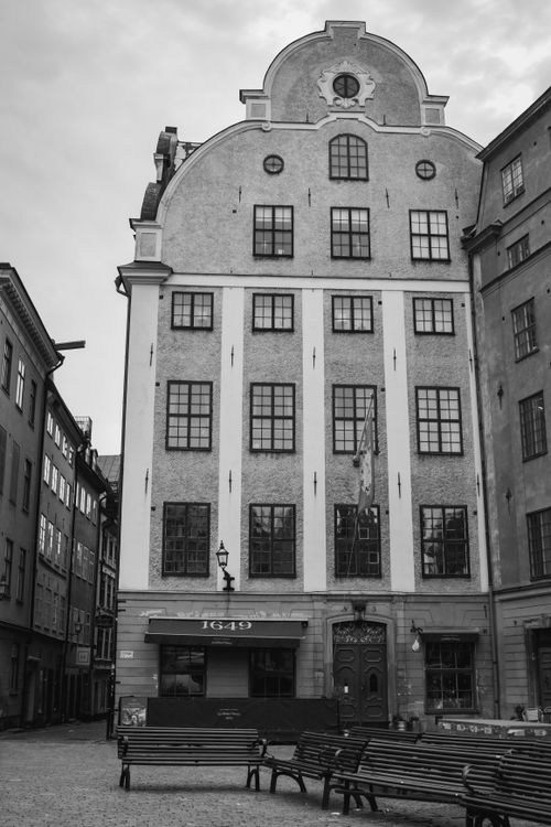 Free Monochrome photo of a historic 1649 building in Gamla Stan, Stockholm, Sweden. Stock Photo